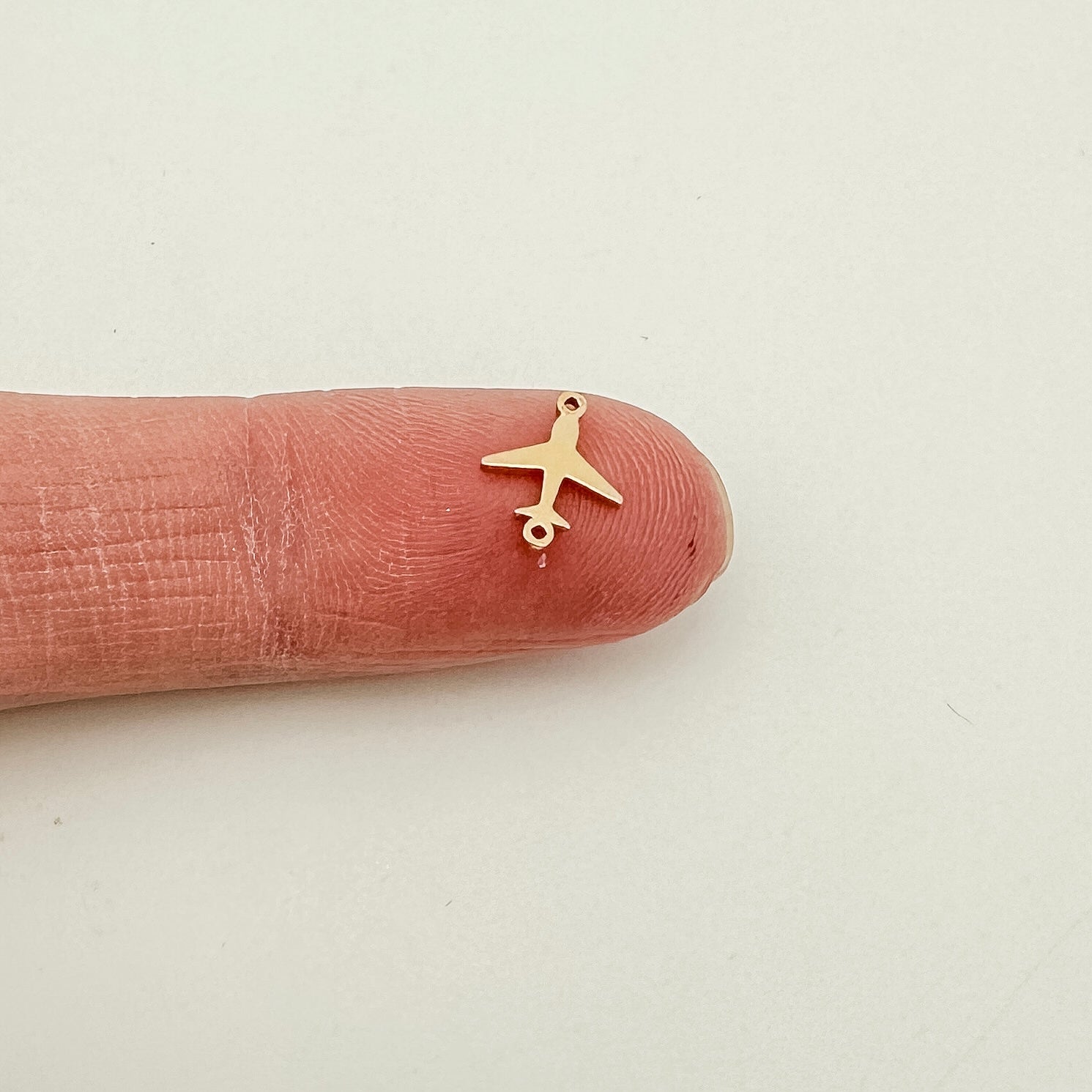 gold filled airplane connector, gold filled connectors, permanent jewelry connectors, essbe jewelry supply, permanent jewelry supplier, airplane charm, airplane connector, sterling silver airplane charm